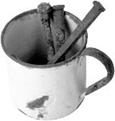 cup with nails